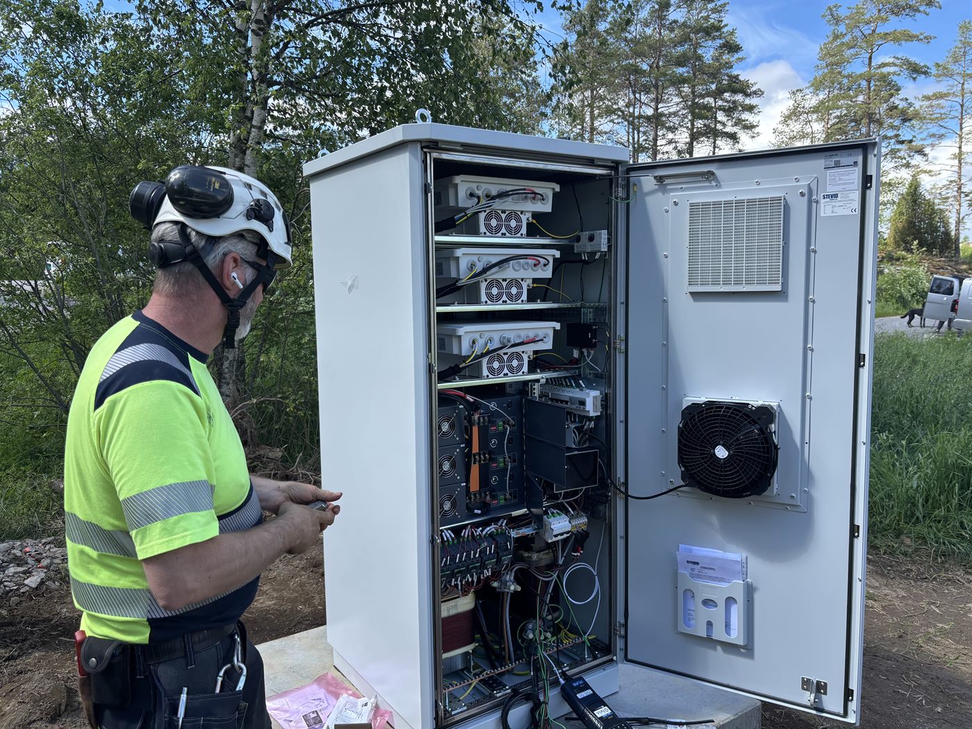 Inspection of power electronics and the battery system in one of the eqGrid cabinets in the field